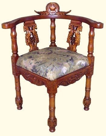 Carved Corner Chair - 18th century reproduction in solid mahogany and finished in a light walnut stain - This chair is fabulous to look at and very comfortable - 34" H.
