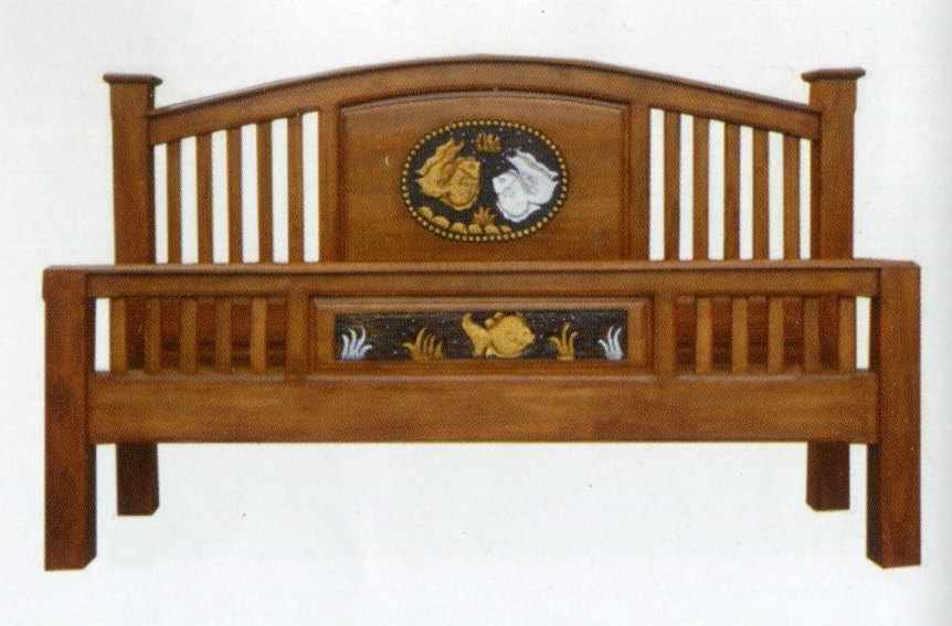 Carved teak wood platform bed with beautiful fish details.