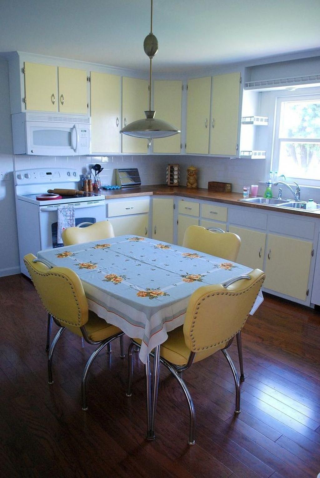 Yellow white two tone kitchen cabinets and vintage inspired decor