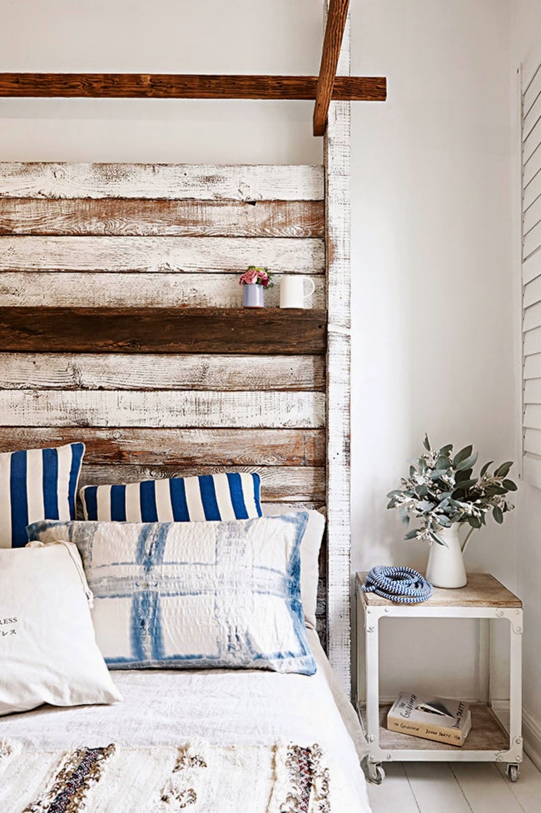 Rustic bedroom with salvaged wood headboard
