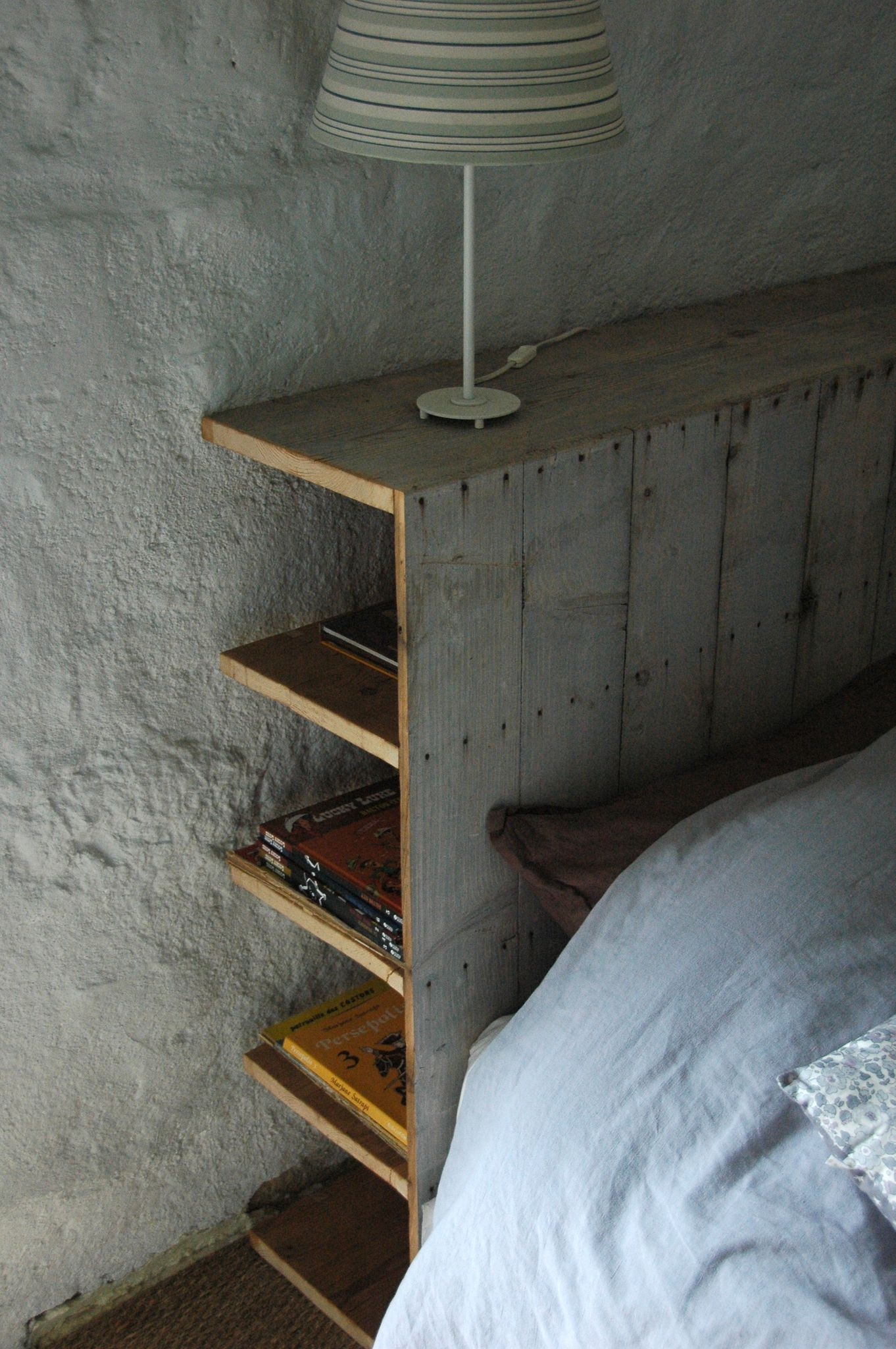 A Wall In This Bedroom Was Fully Built-In With Shelving, Headboard, And  Side Tables