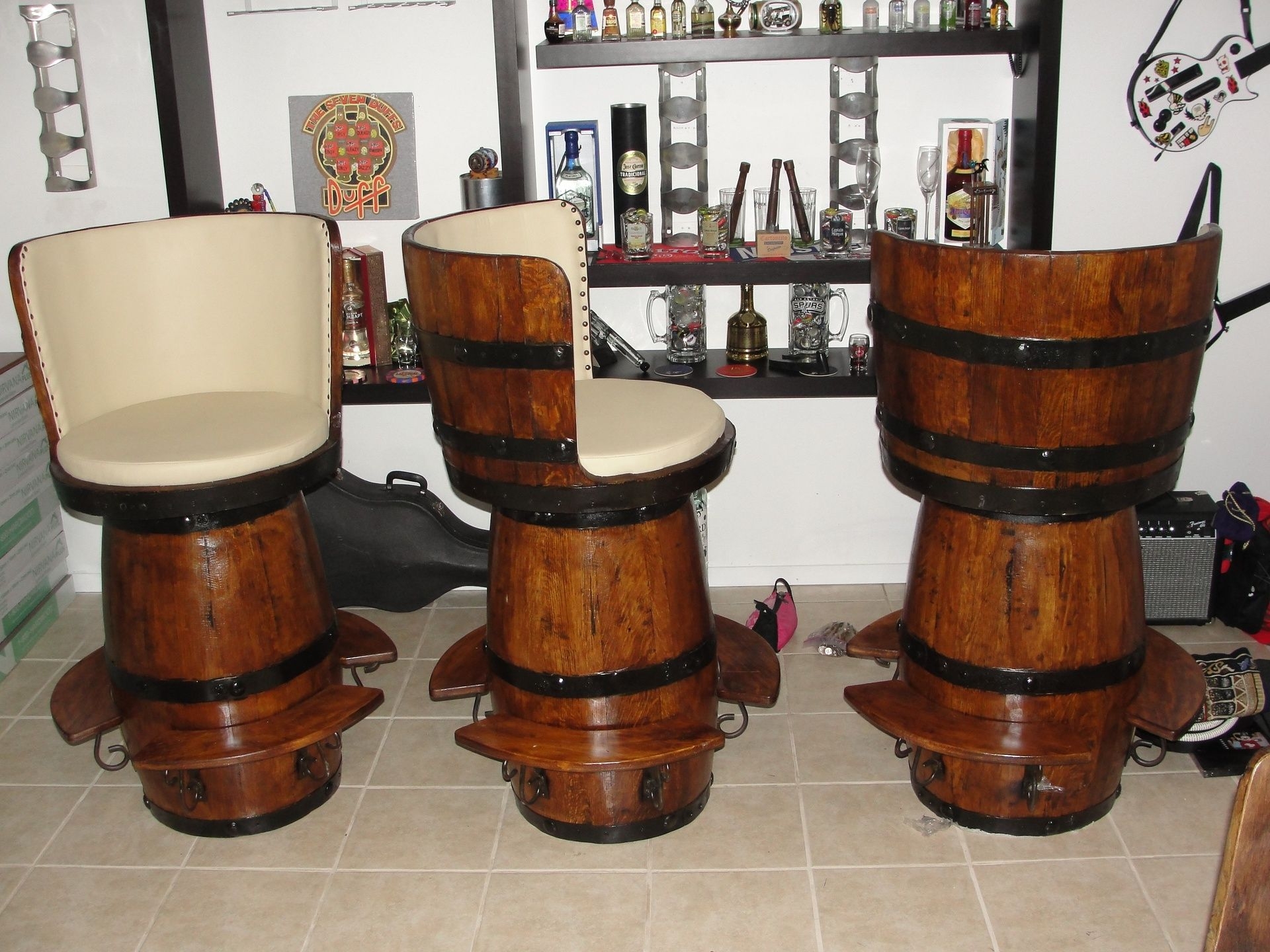 Huge bar stools made out of tequila barrels great for