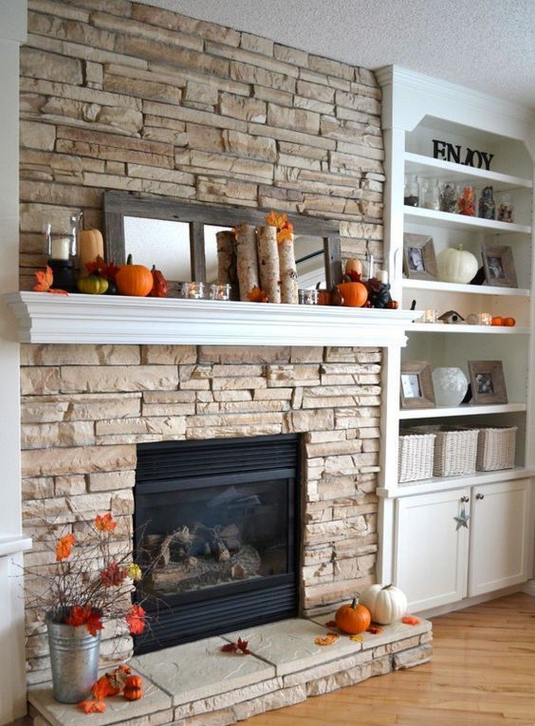 Stacked stone fireplace with built ins