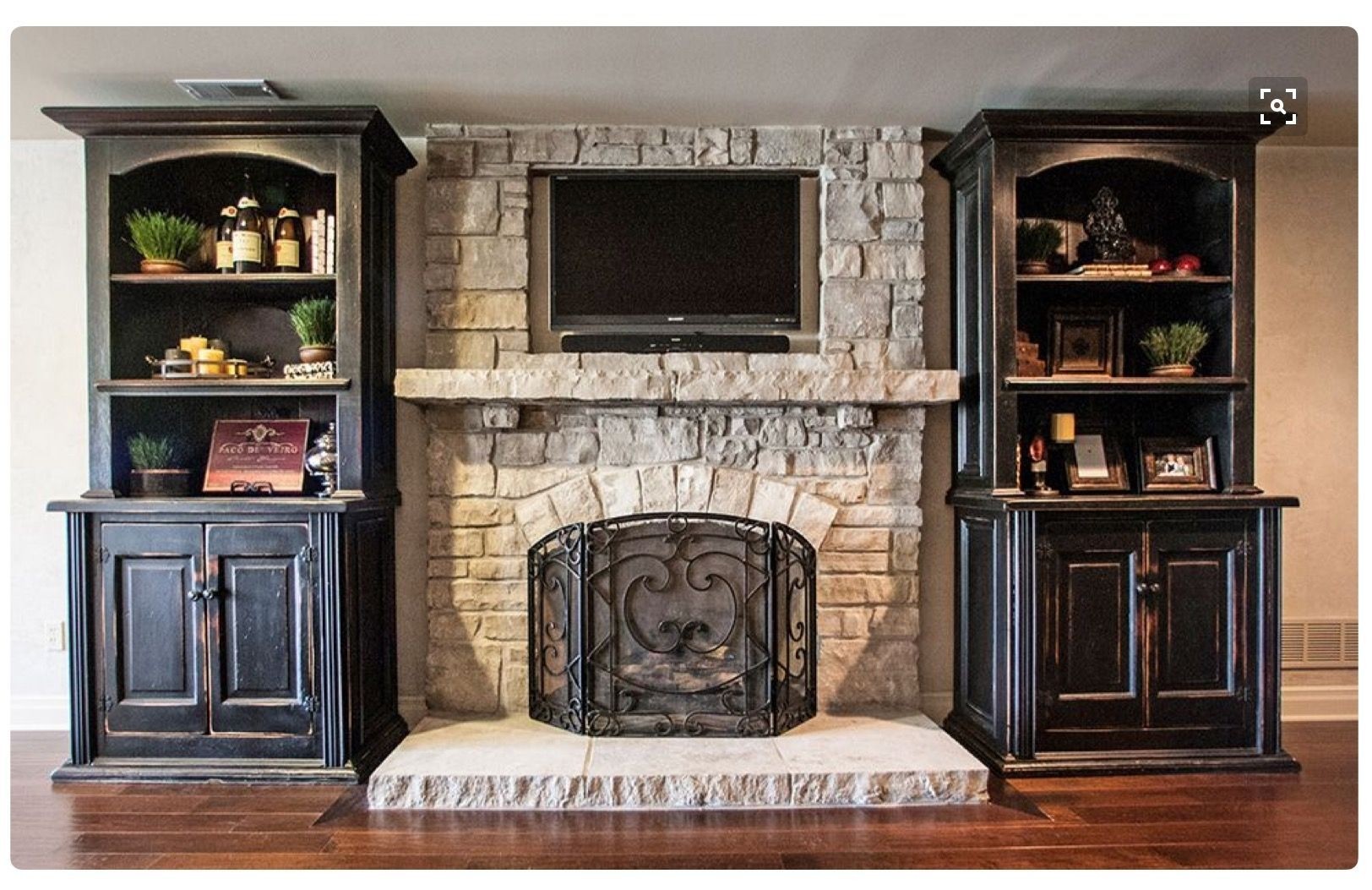 Stone fireplace with shelves