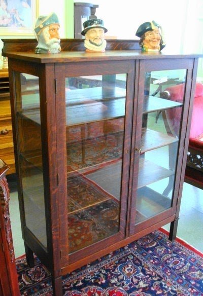 Antique curved glass curio cabinet