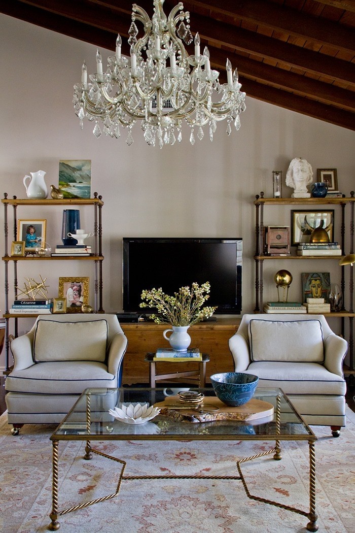 Bookshelf styling emily henderson living room_chair coffee table shelf chandelier