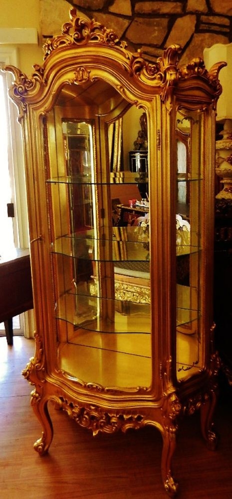 Gold curio cabinets 4