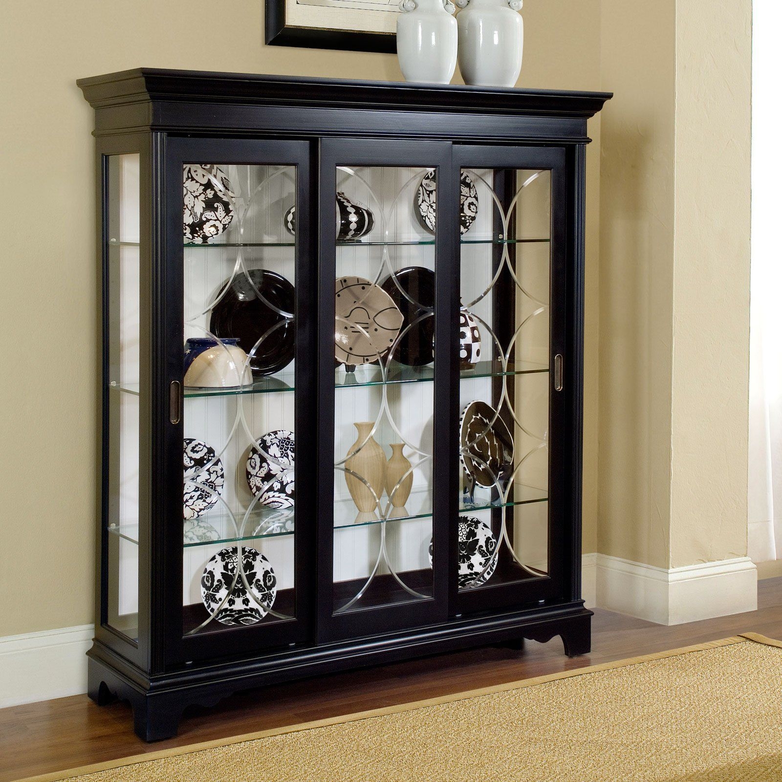 small curio cabinet with glass doors