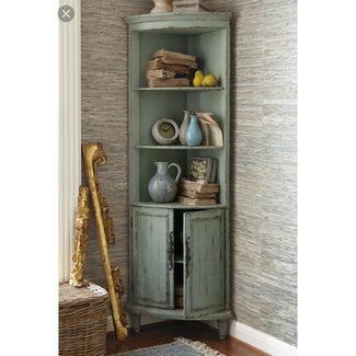 tall white corner cabinet with glass doors