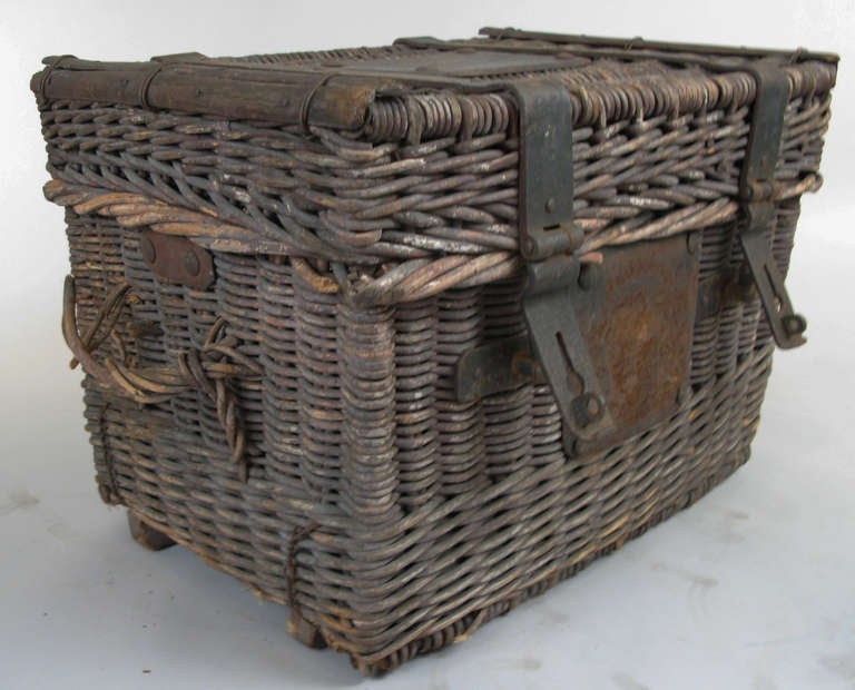 Antique woven rattan trunk with forged iron straps