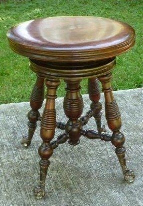 Beautiful antique piano stool with ball claw feet