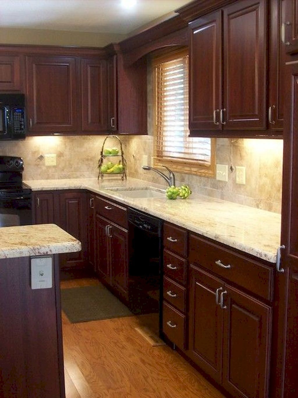 Cherry cabinets with light granite