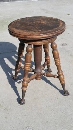 For sale a antique piano stool very cool adjustable up