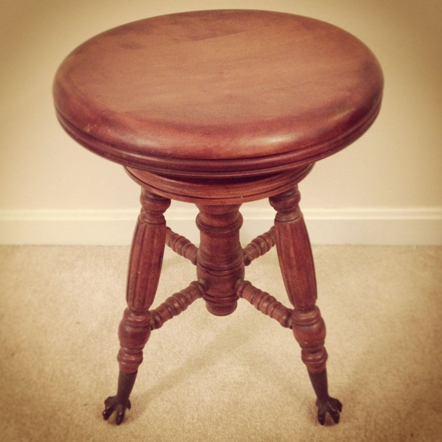 Victorian era antique piano stool with ball and claw feet