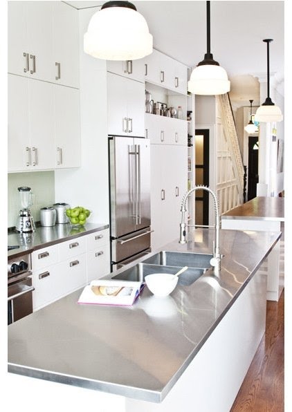White cabinets with stainless steel countertops
