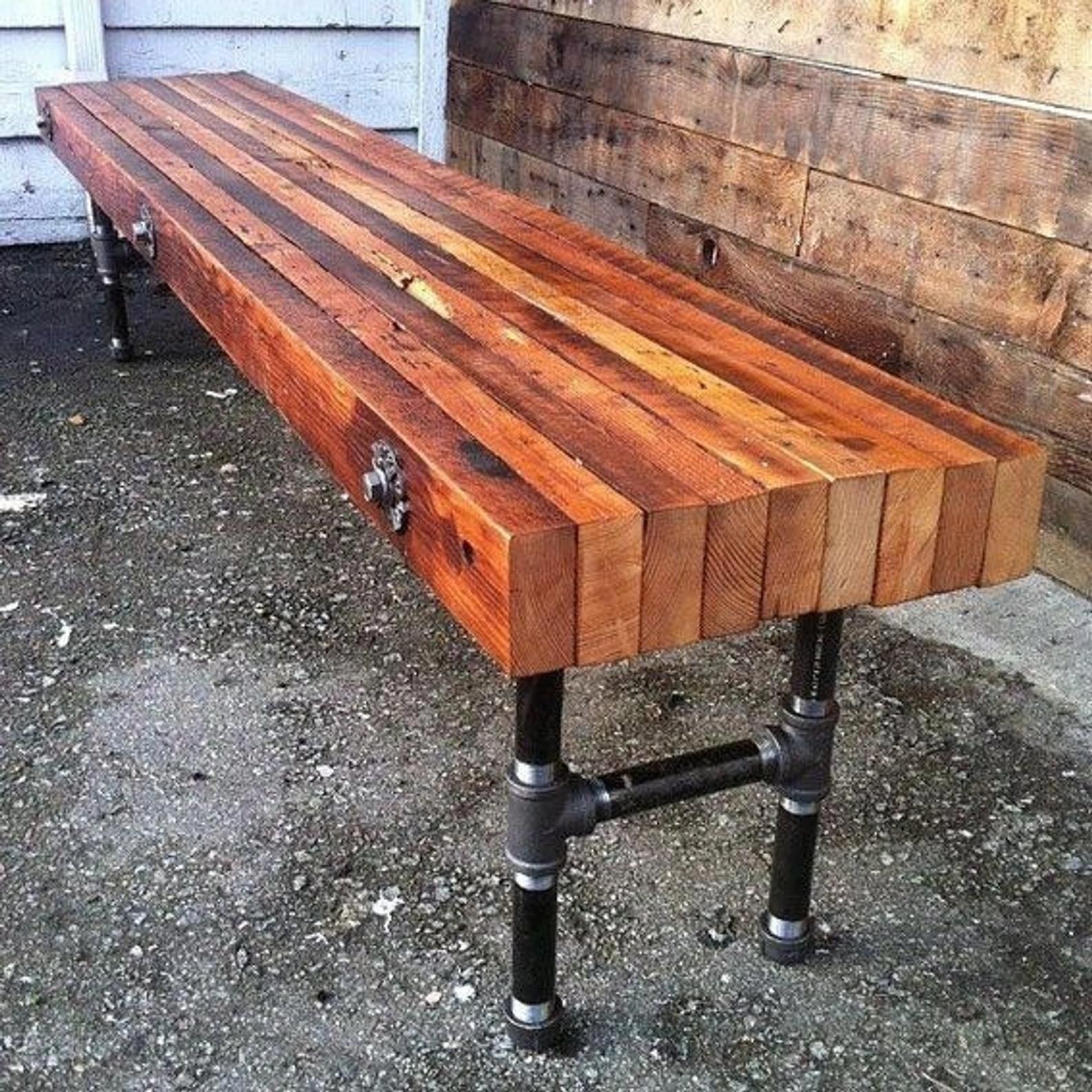 Custom made reclaimed wood bench with industrial cast iron legs