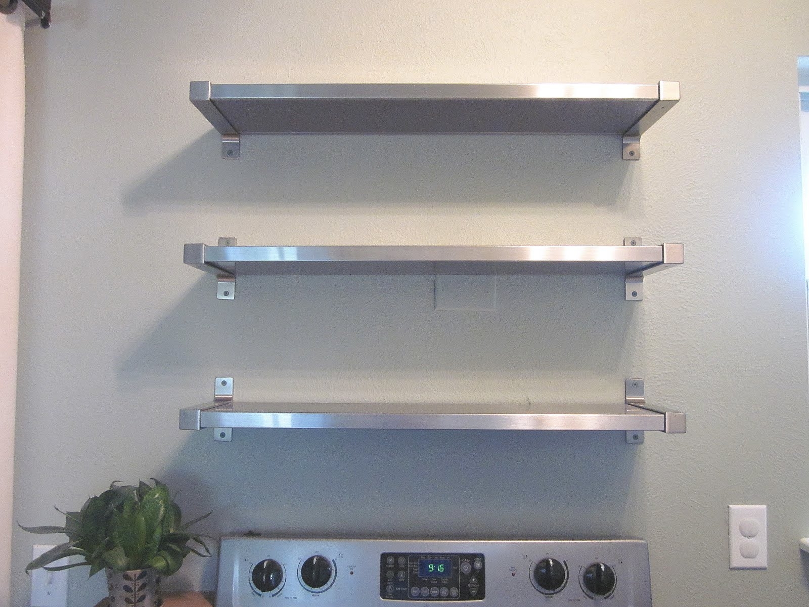 Floating stainless steel kitchen shelves