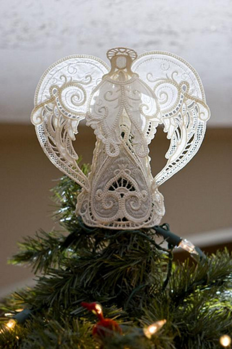 Beautiful angel christmas tree topper perfect for keeping an eye