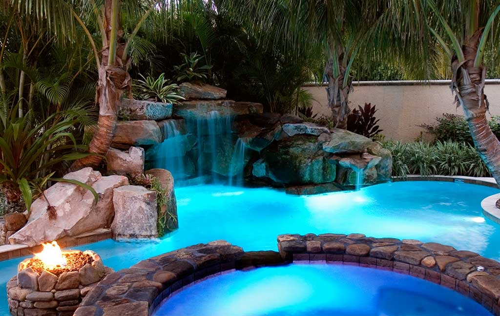 Lagoon pool with grotto waterfall spa and fire pit by