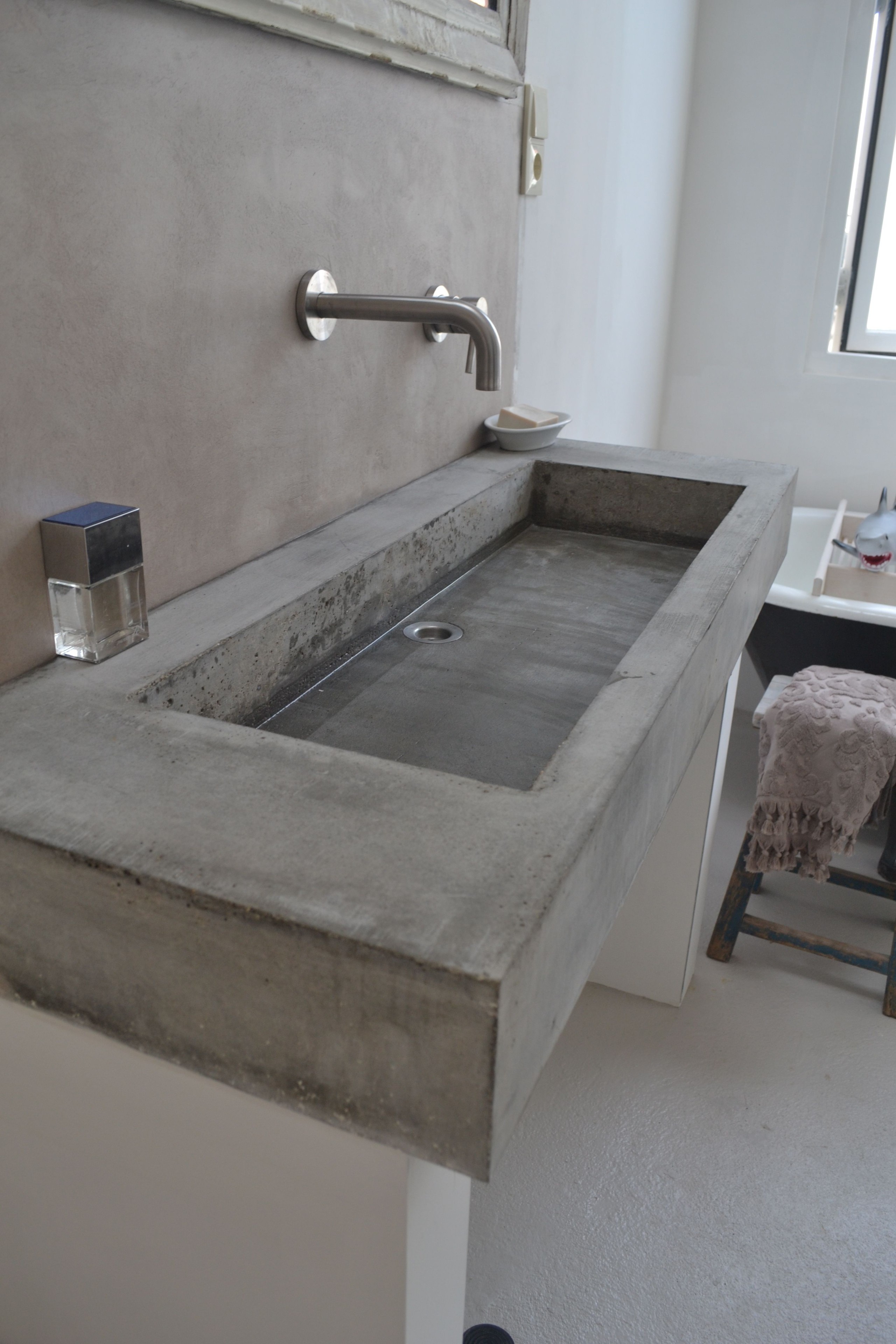 Wall mounted trough sinks for bathrooms