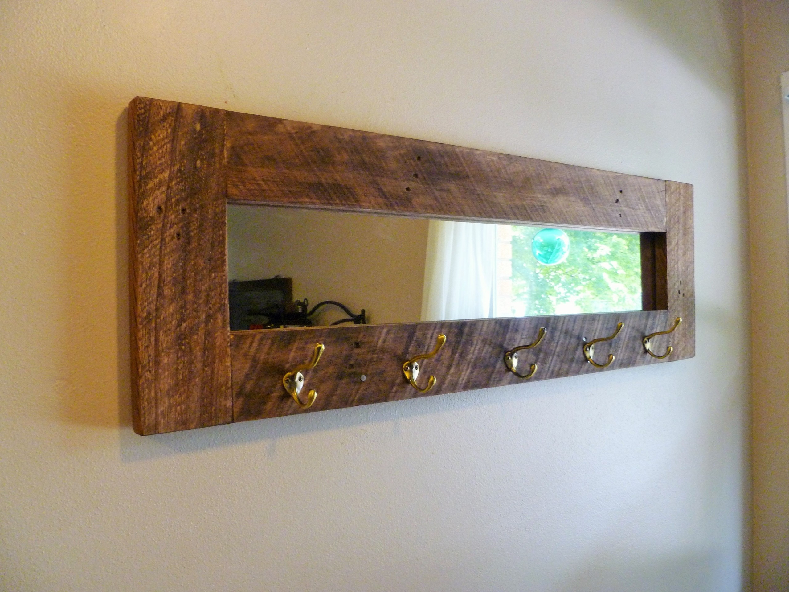 Hallway mirror with online coat hooks