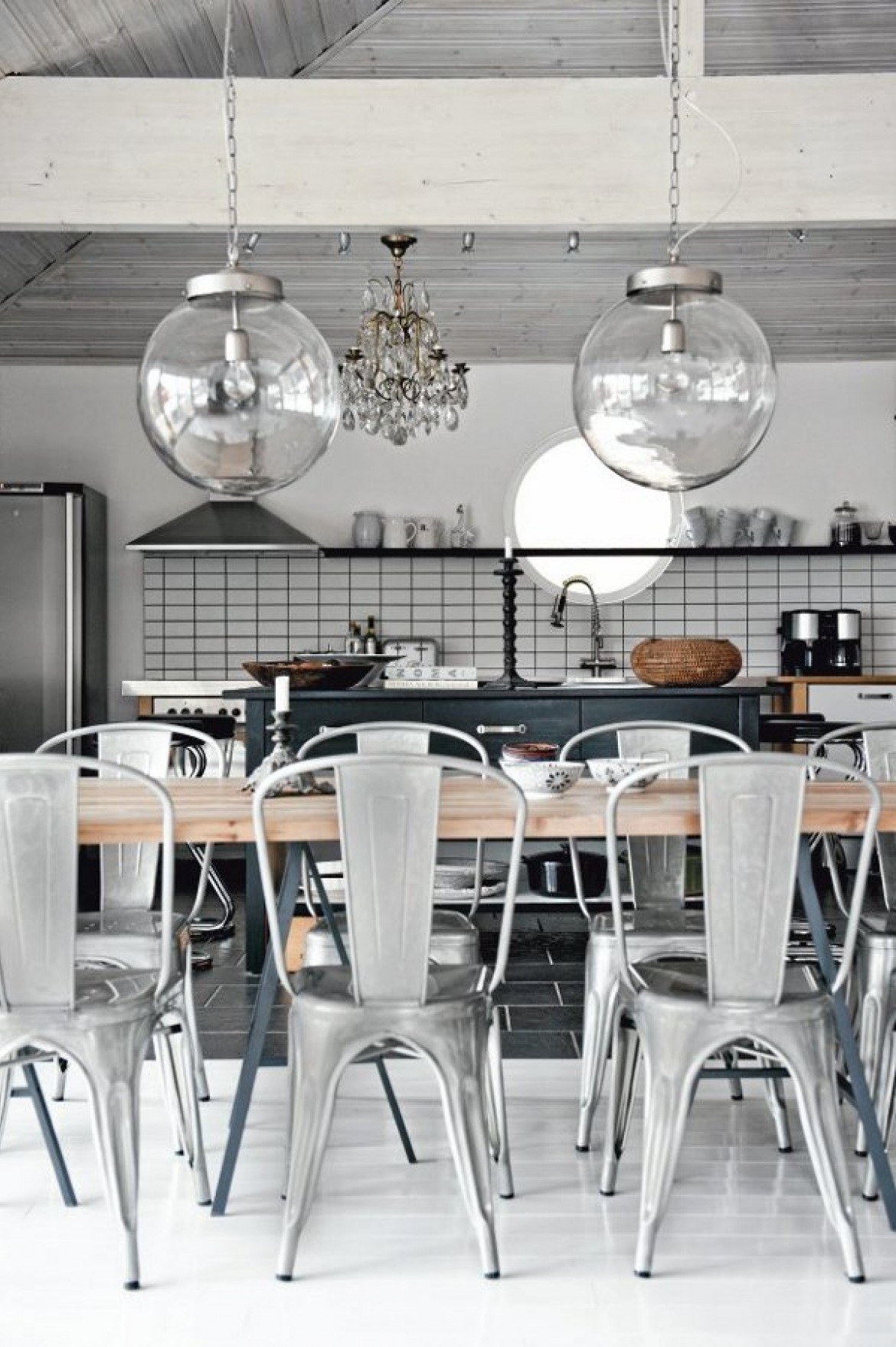 Industrial kitchen tolix chairs and large globe pendants