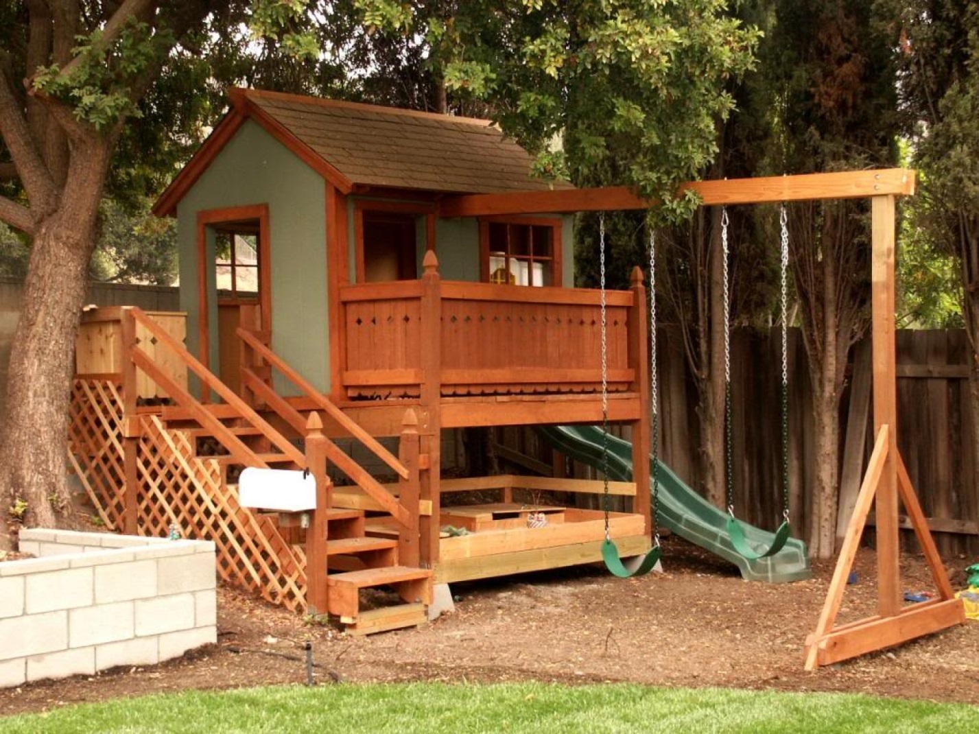 Wood playhouse with slide