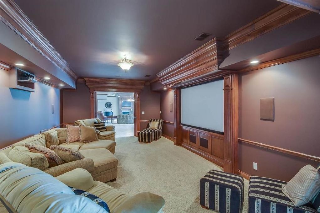 Traditional home theater with carpet sectional sofa crown molding paint