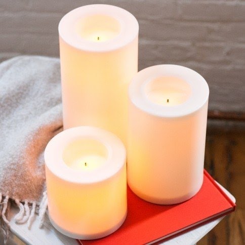 Large indoor outdoor flameless candle with programmable timer by candle
