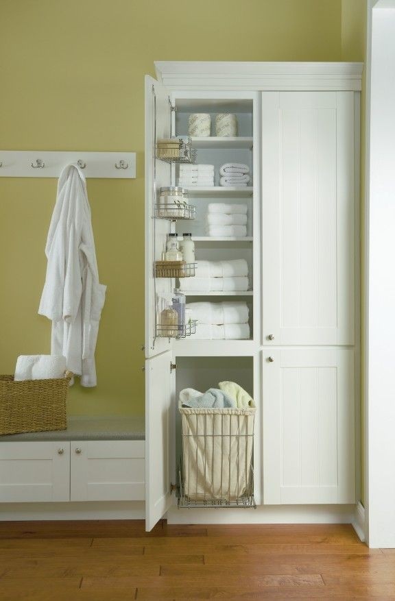 Linen cabinet with hamper
