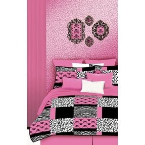 teen girl bedroom with hot pink zebra girly skull decals framed in black frames on a wall covered in and cheetah print wall paper