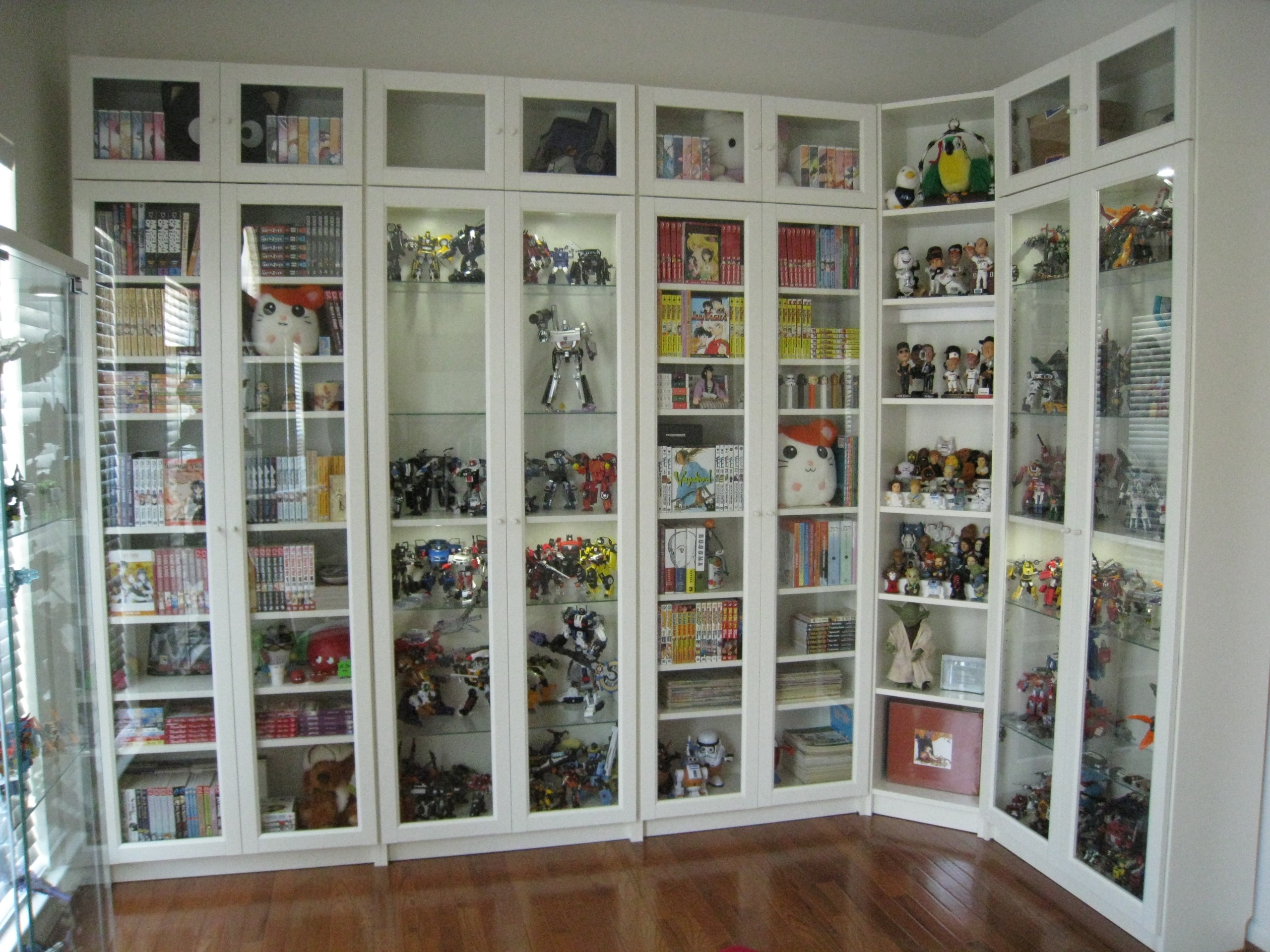 Wooden bookcases with glass doors