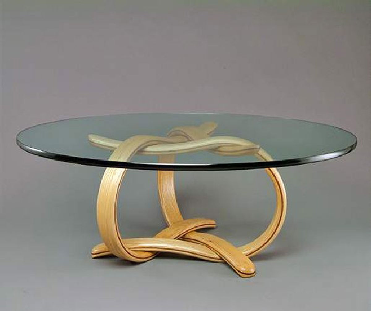 Round wood coffee table with glass top