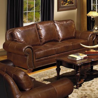 Brown leather sofa with nailhead trim