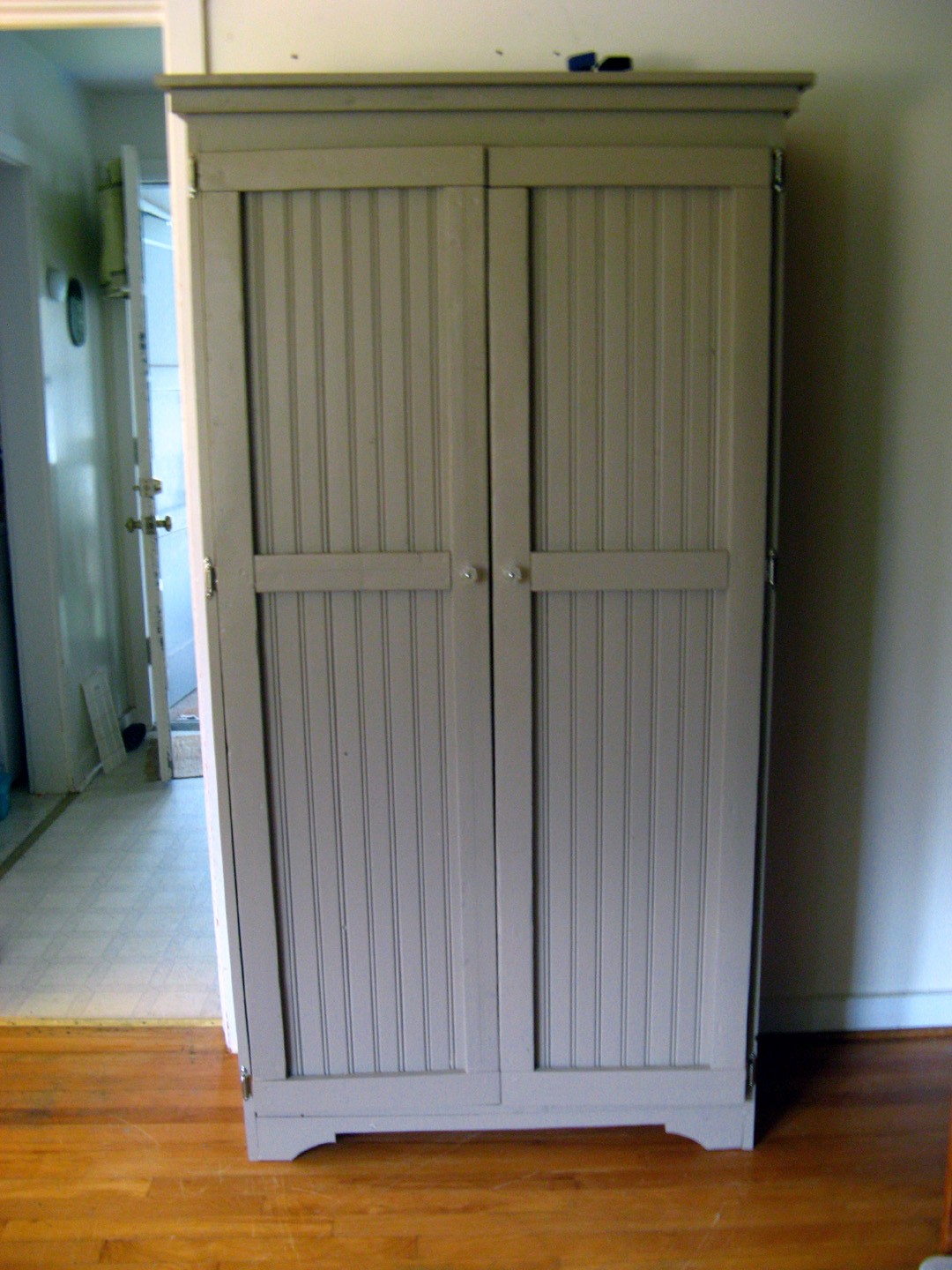 Free standing coat closet with doors hot sale