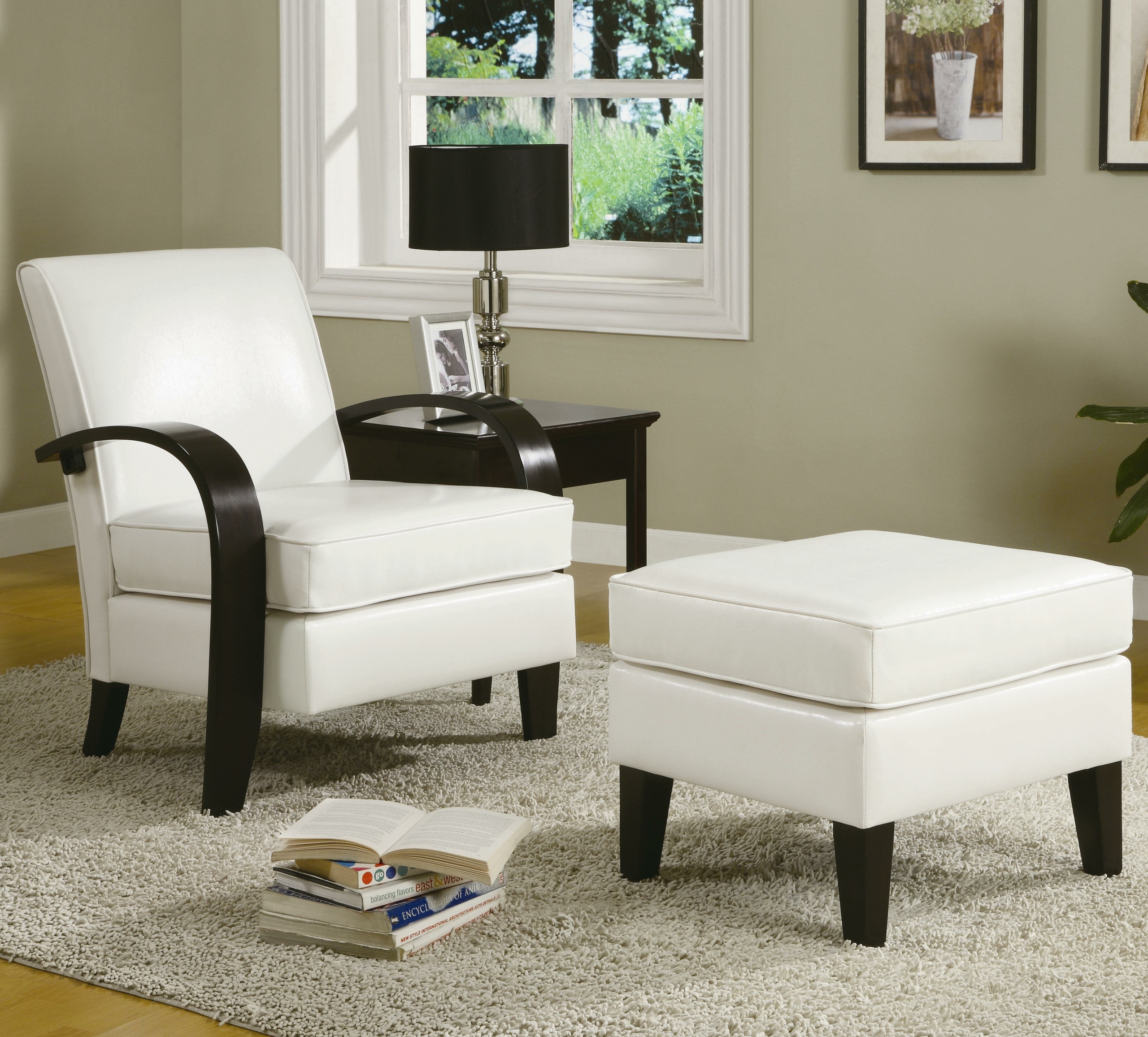 Small leather chairs with ottomans 17