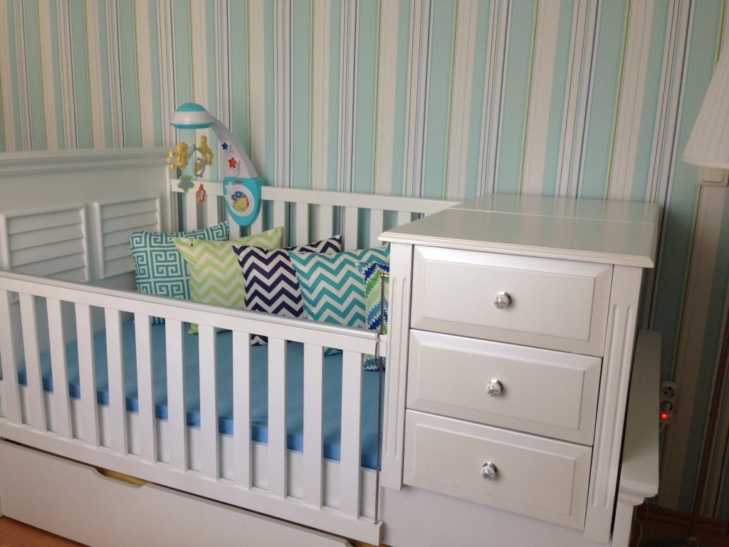 white crib with drawer underneath