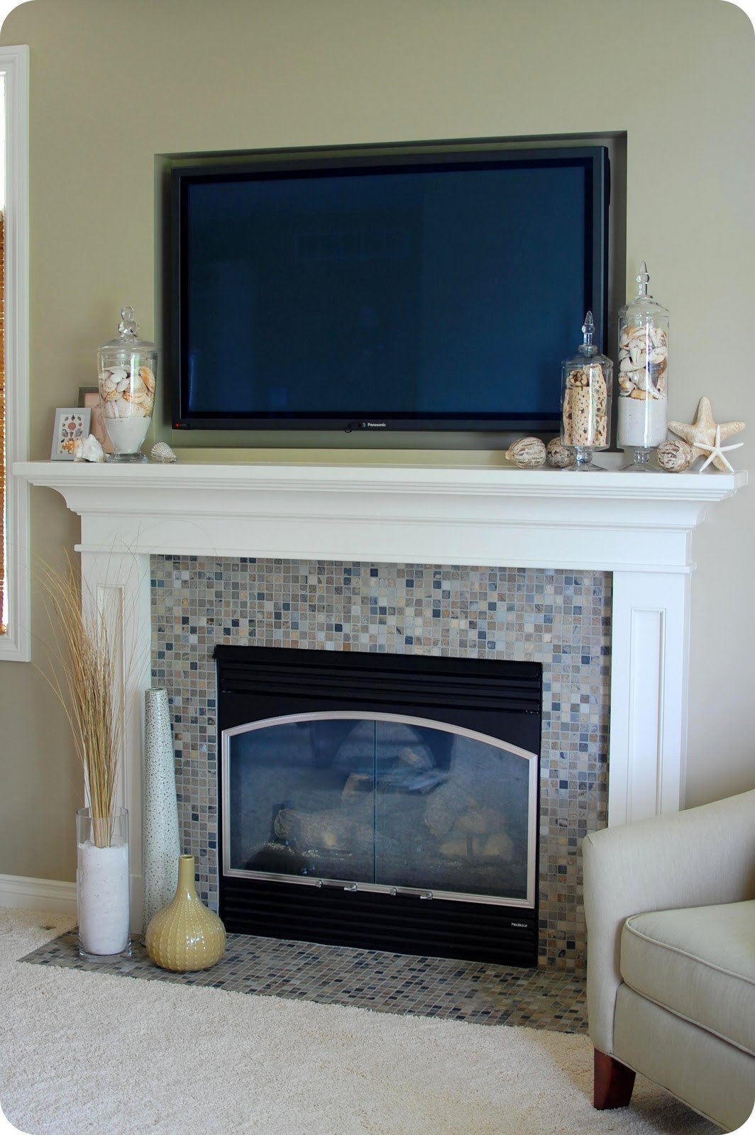 Tv stand deals above fireplace