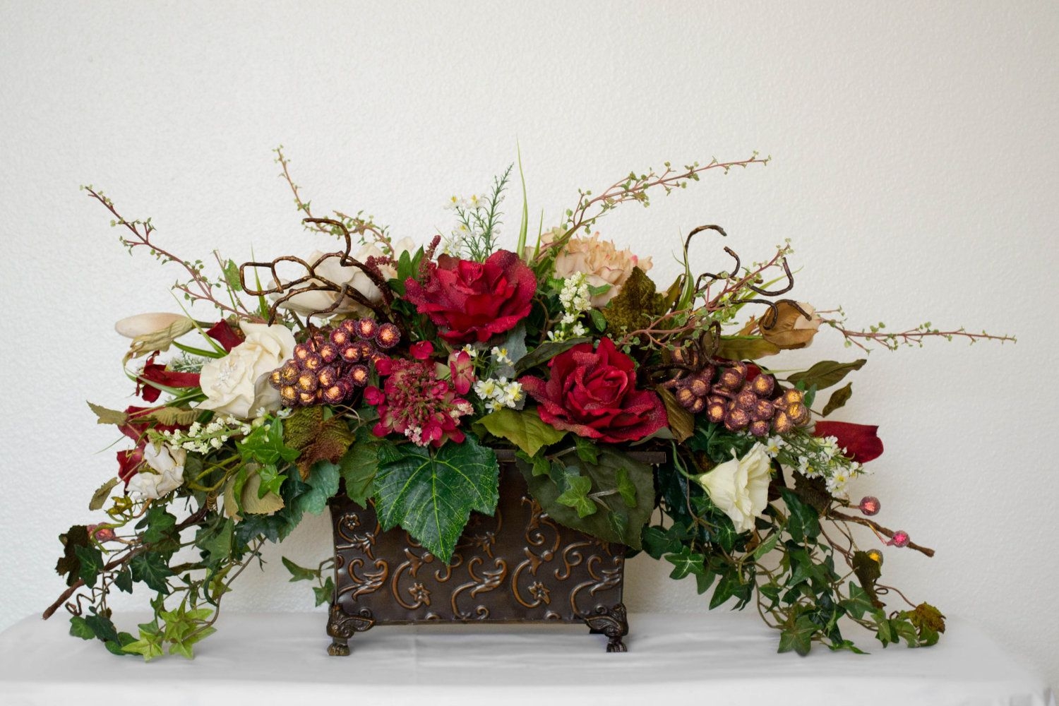 Silk floral arrangements with roses and