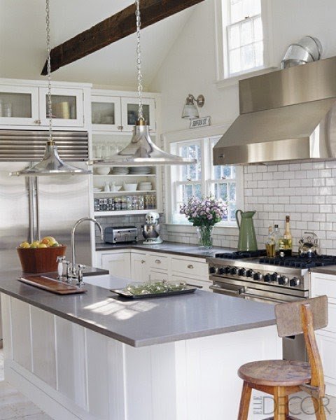 White kitchen island with stainless steel top
