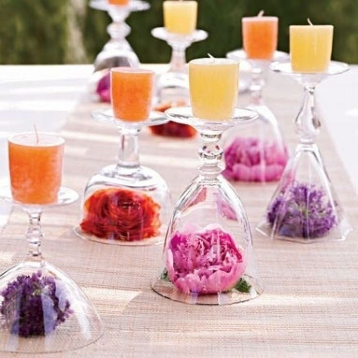 Such a cool centerpiece using silk flowers and wine glasses
