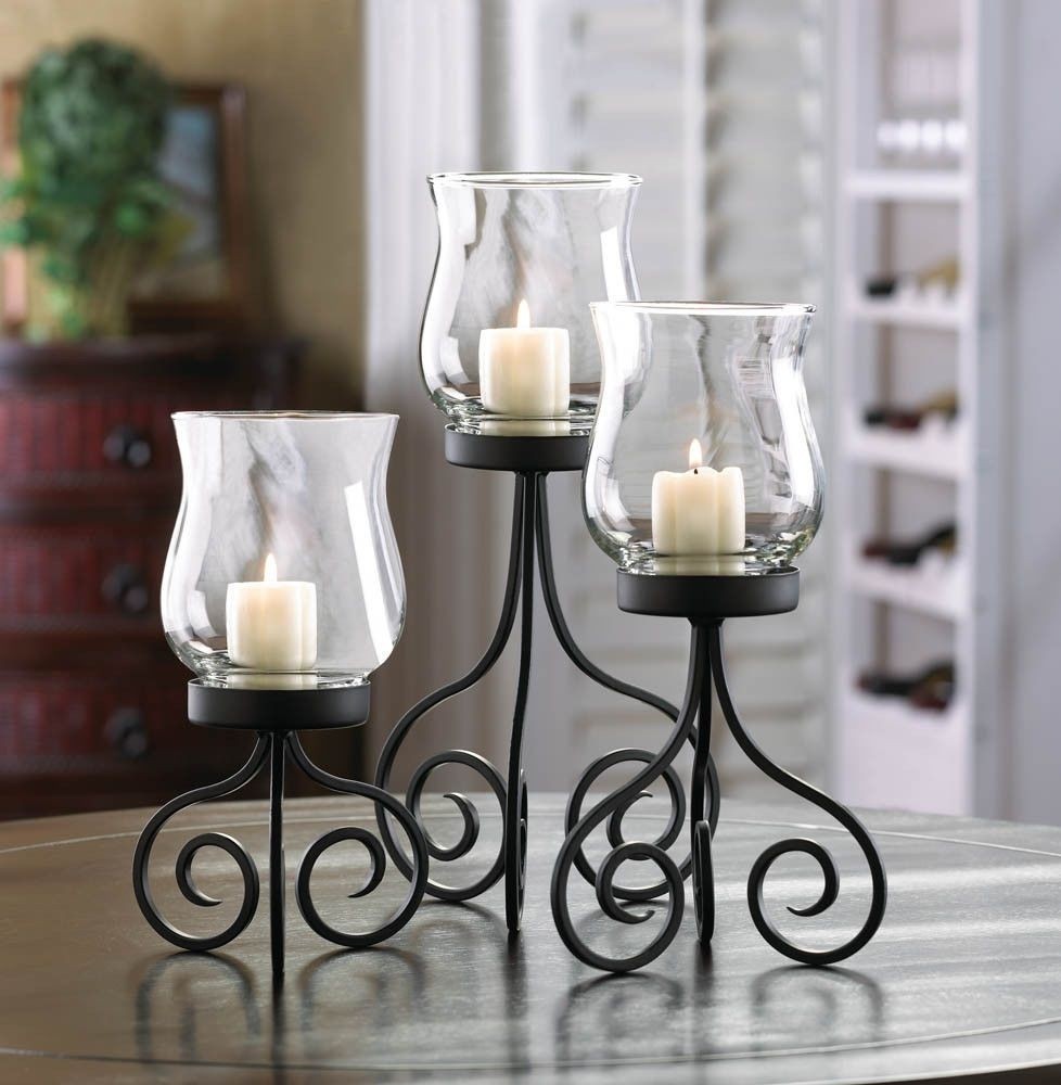 Glass and iron candle on sale holders