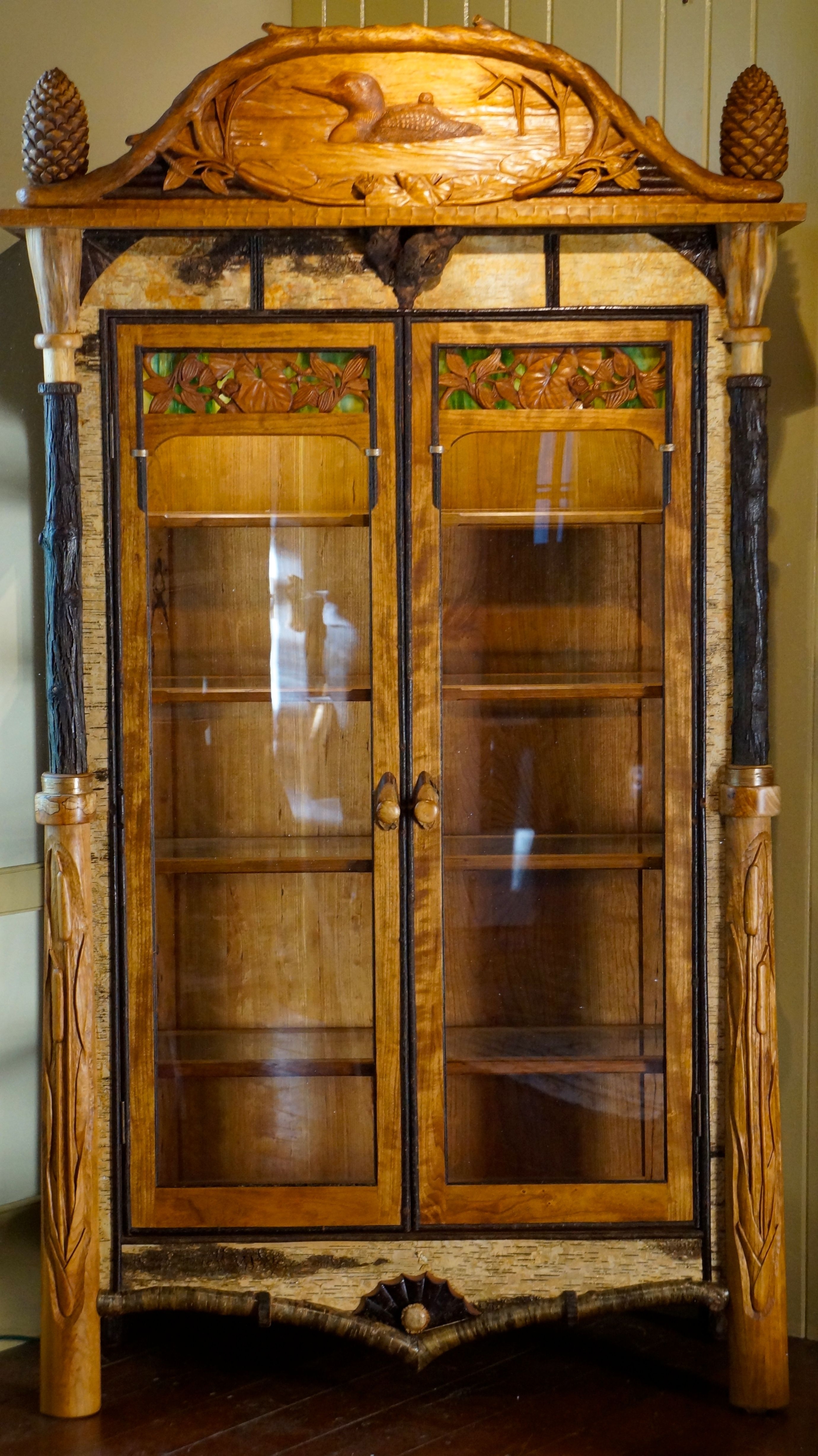 Adirondack rustic curio cabinet with carvings