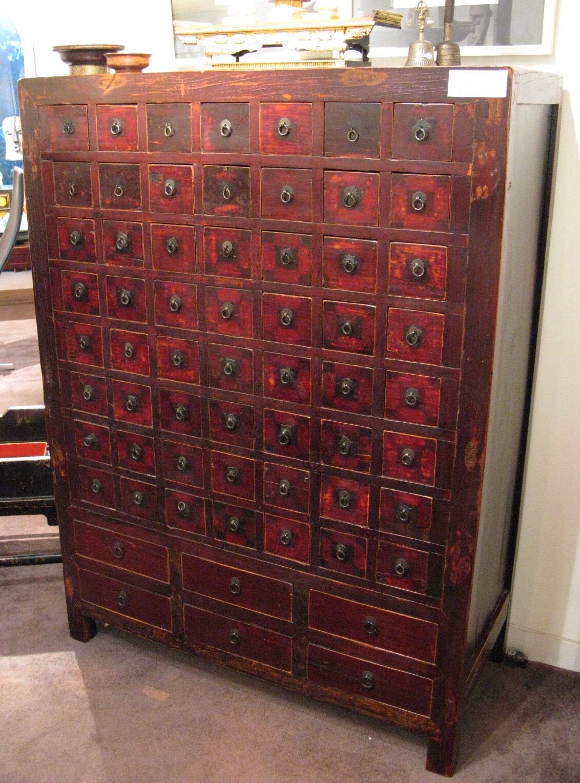 Cabinet with many small drawers