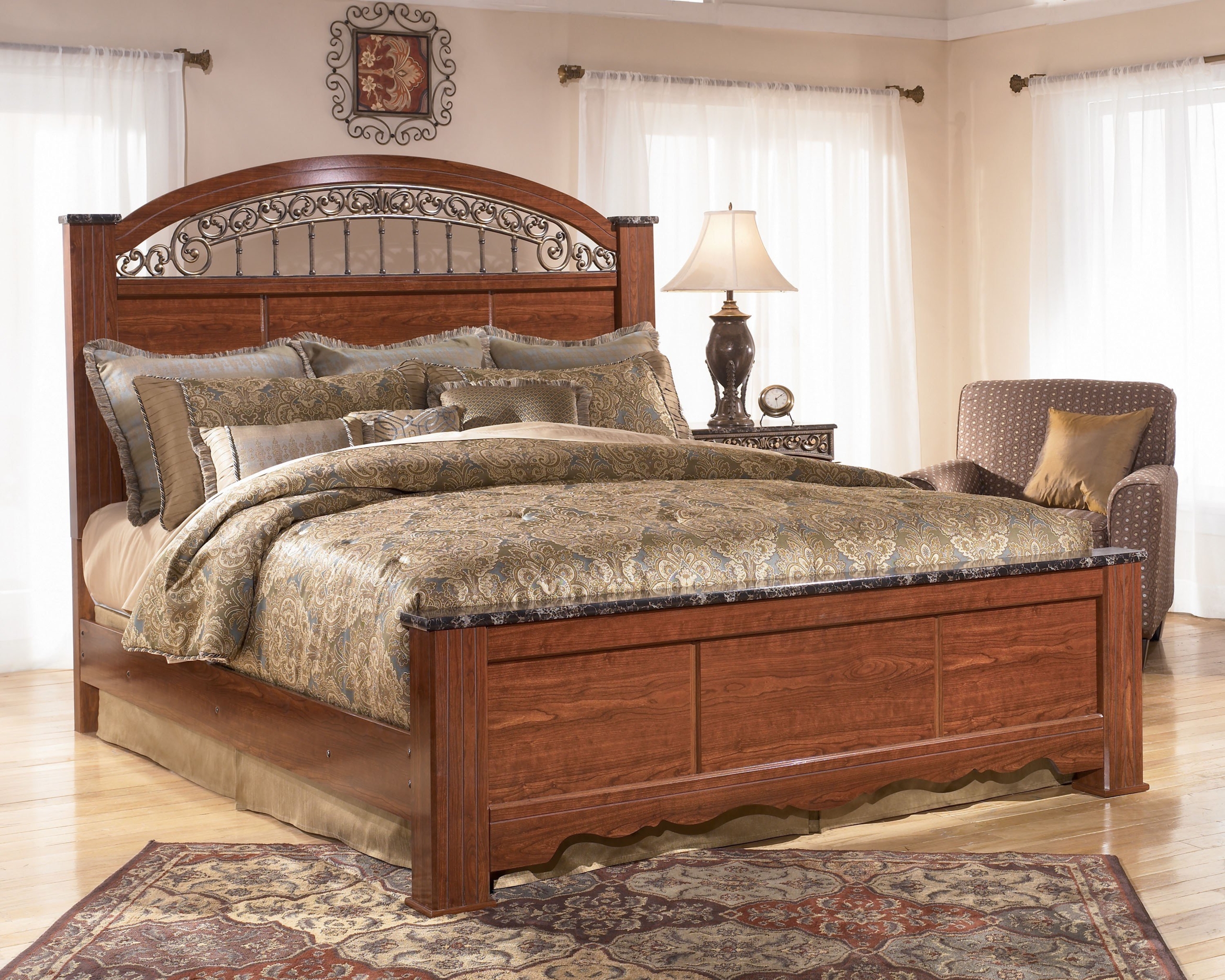 Constructed of red brown finished faux cherry wood this king