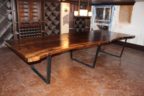 Contemporary rustic tables crafted from large slab black walnut the