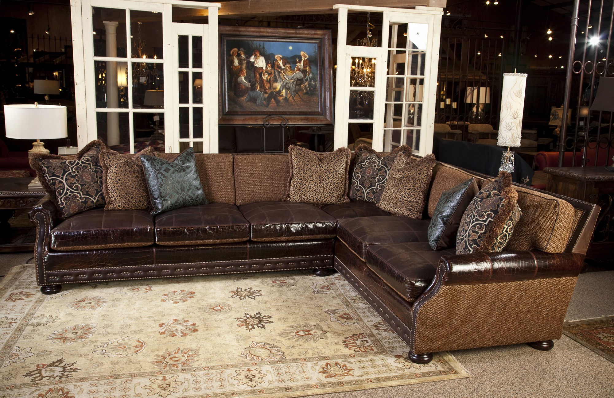 tan leather sofa with fabric cushions