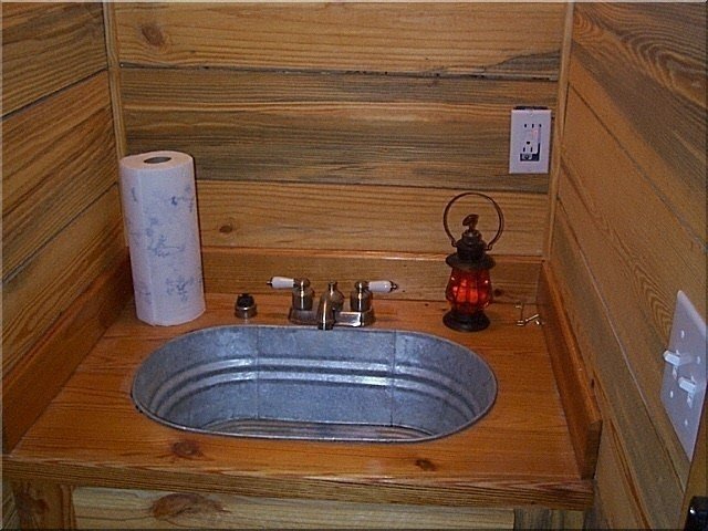 galvanized sink pipes in bathroom wall old construction