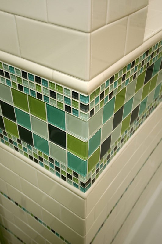 Colorful glass tile border in the bathroom perfect for a