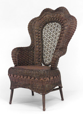 Dark natural wicker arm chair with scalloped shaped high back